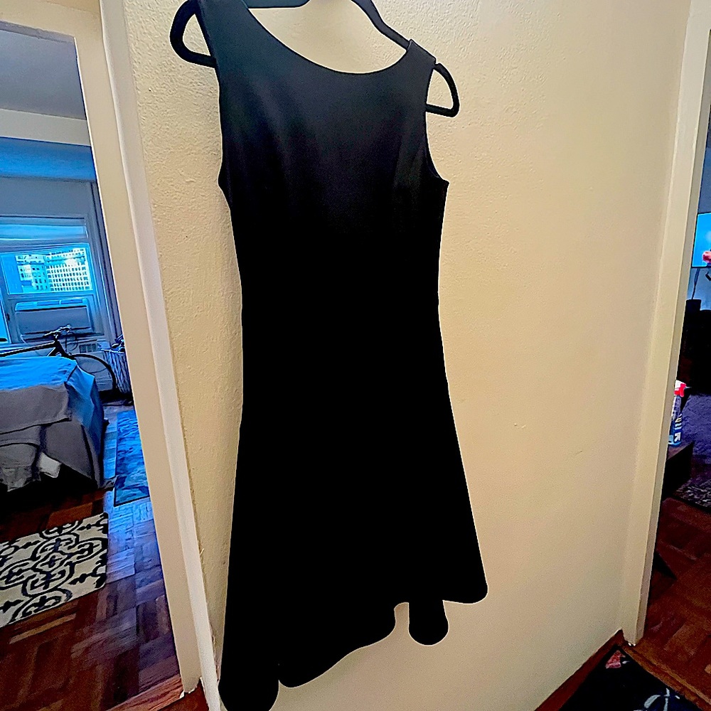Beautiful Lycra black dress. Flattering on any figure.